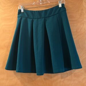 Teal pleated mini skirt. Limited size 4. Super cute and in good condition
